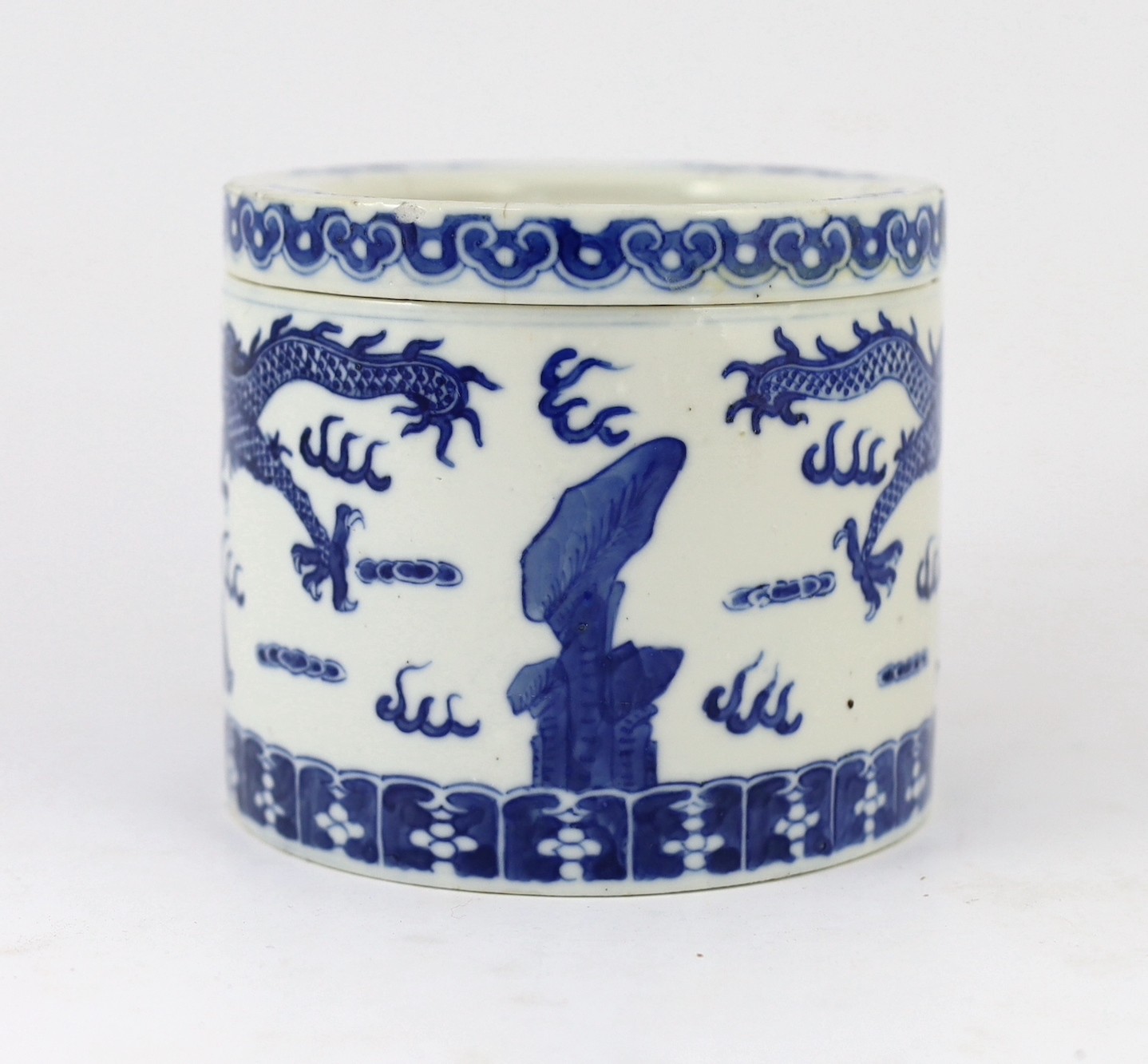 An unusual Chinese blue and white 'dragon' box and cover, 19th century, 10.5cm high, lid repaired, rim chip